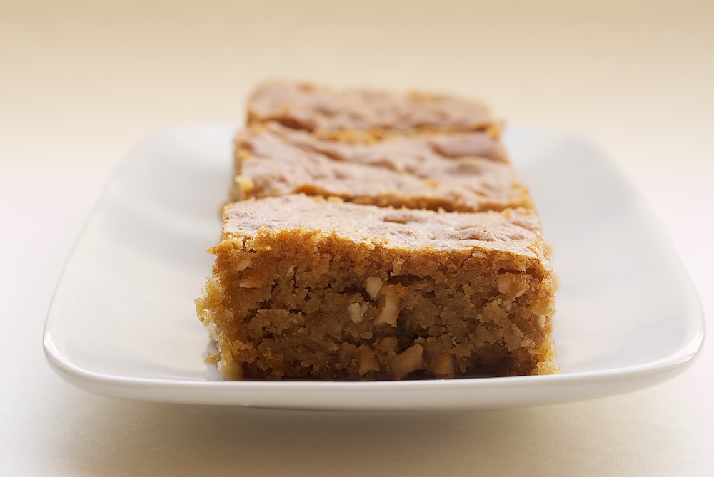 sliced Brown Sugar Cashew Blondies on a white tray