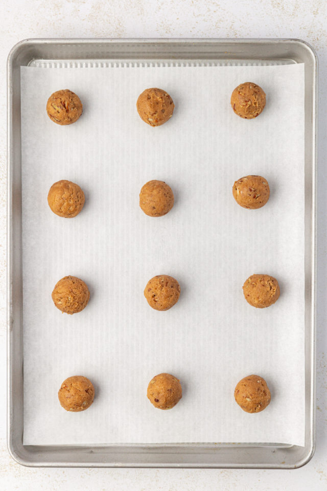 Overhead view of brown sugar crinkle cookie dough rolled into balls