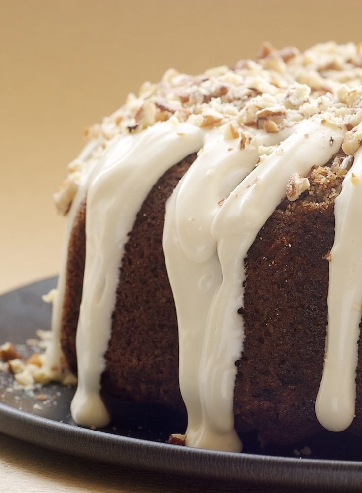 Hummingbird Bundt Cake on a dark cake plate