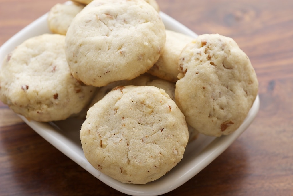 Cream Cheese Shortbread-Dulce de Leche Sandwich Cookies combine a soft, light, nutty shortbread with rich dulce de leche for an irresistible cookie. - Bake or Break