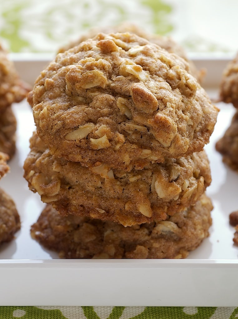 Toffee Almond Oatmeal Cookies stacked on a white tray