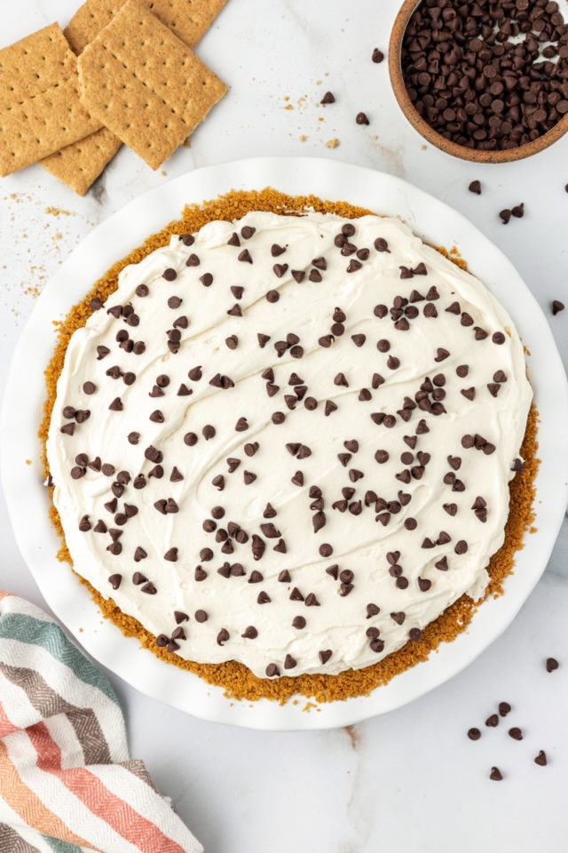 Overhead view of whole chocolate cookie dough cheesecake in pie dish