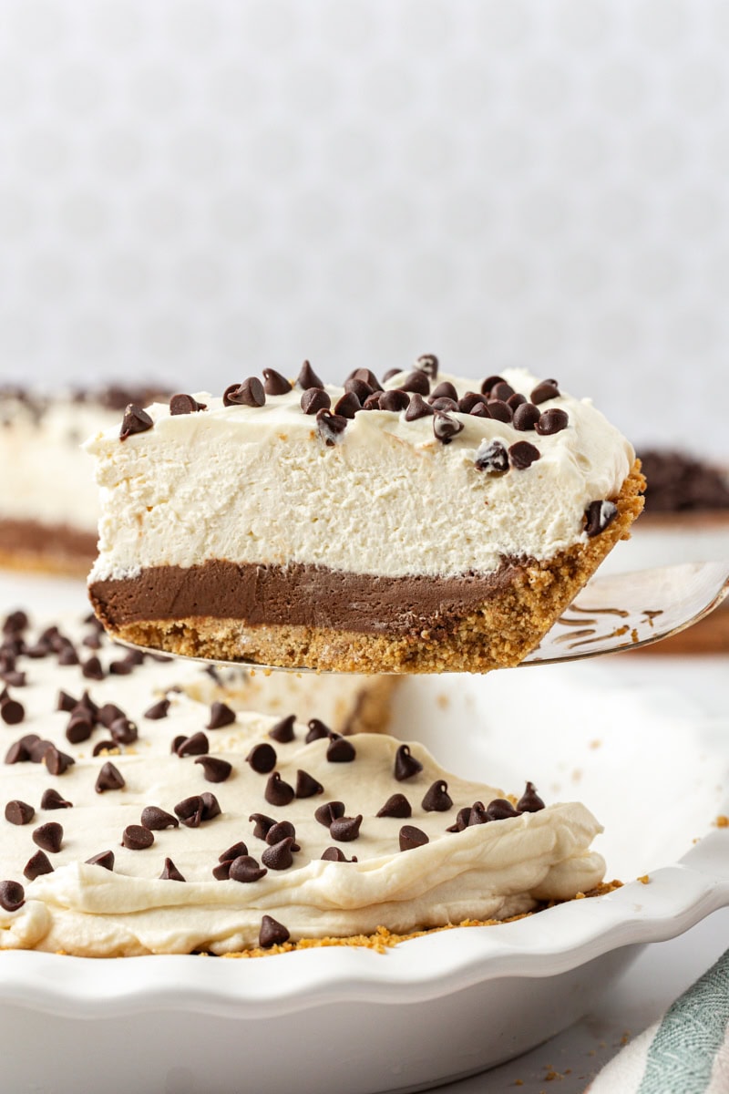 Lifting slice of chocolate cookie dough cheesecake