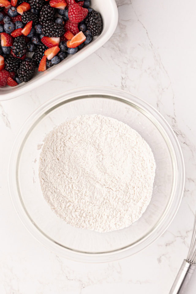 Overhead view of dry ingredients for cobbler topping in mixing bowl