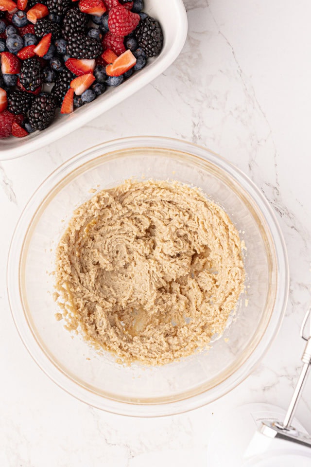 Overhead view of wet ingredients for cobbler topping in bowl