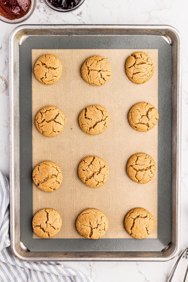 Peanut butter cookies on silpat-lined baking sheet