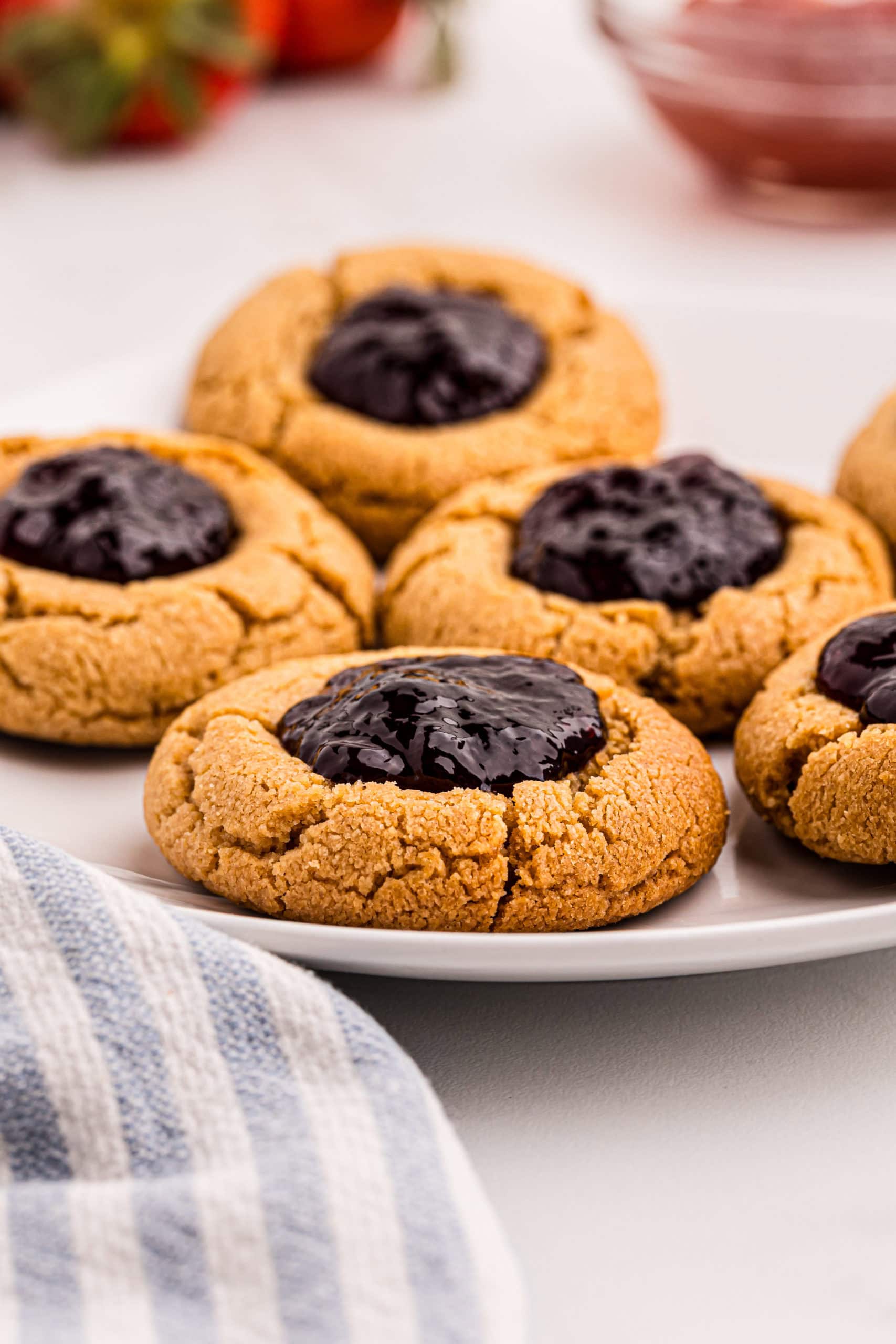 Plate of peanut butter and jelly thumbprint cookies