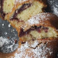 Black Cherry Sour Cream Coffee Cake dusted with confectioners' sugar
