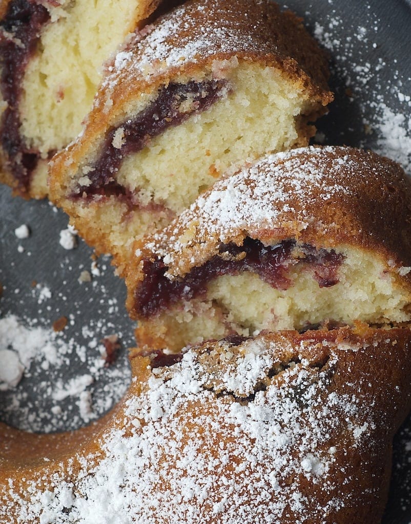 Black Cherry Sour Cream Coffee Cake dusted with confectioners sugar