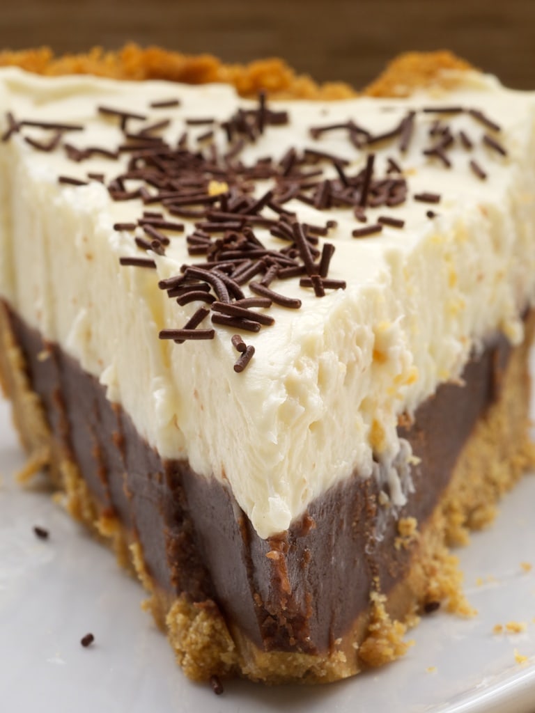 close-up shot of a slice of Chocolate Cookie Dough No-Bake Cheesecake