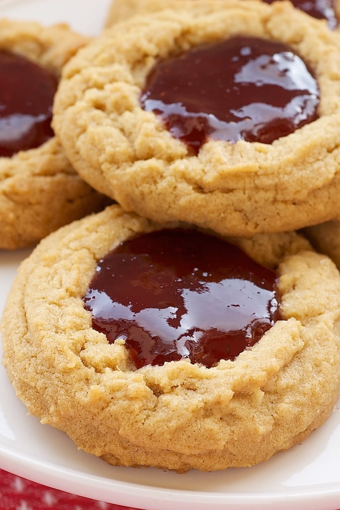 Peanut Butter and Jelly Thumbprint Cookies on a white plate.