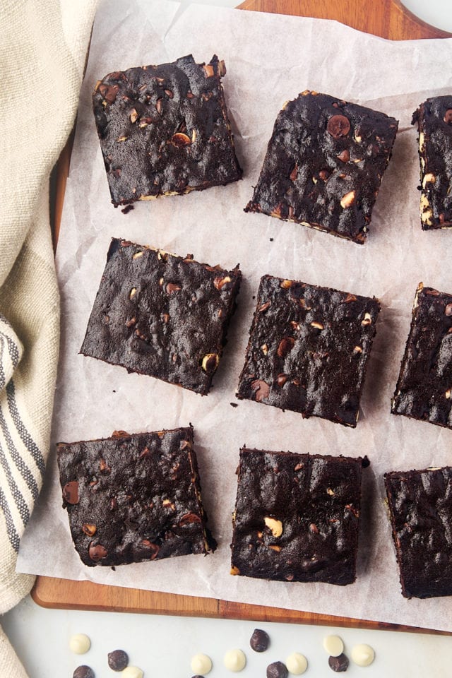 Overhead view of triple chocolate brownies on parchment paper