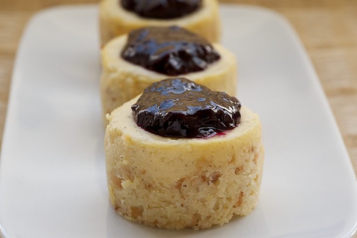 Vanilla Bean Mini Cheesecakes with Blueberry Sauce