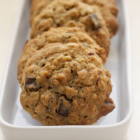 Banana Pecan Chocolate Chunk Cookies take chocolate chip cookies and amp them up with bananas, oats, and nuts. Delicious! - Bake or Break