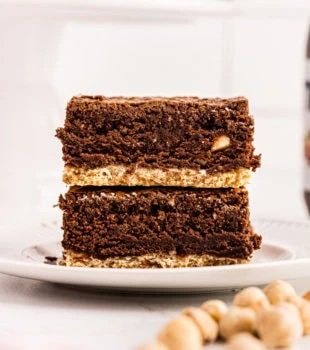 Two Nutella brownies stacked on plate