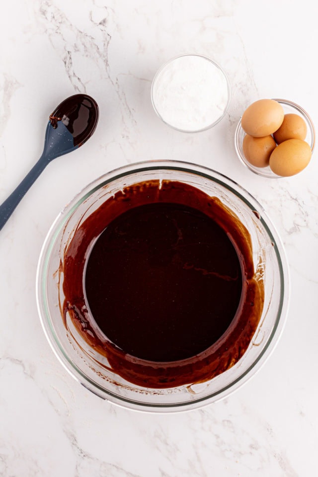 Overhead view of melted butter and chocolate in bowl