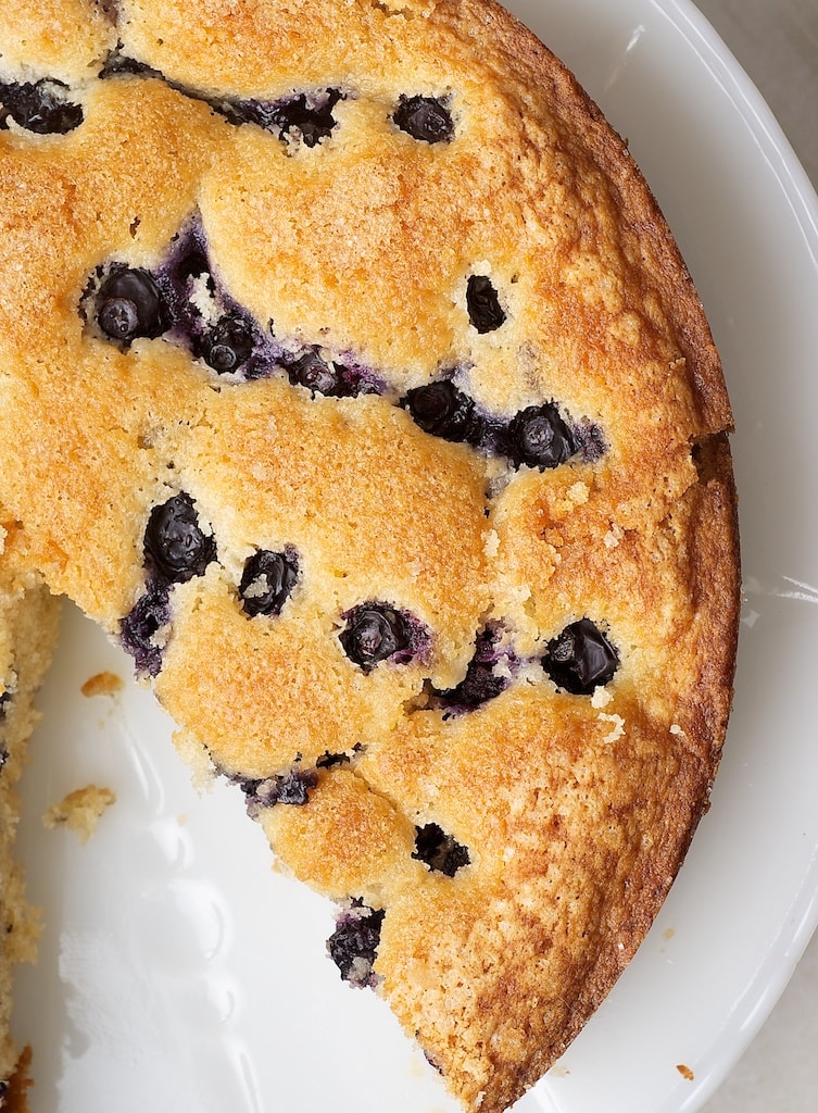 overhead view of Simple Blueberry Cake on a white cake stand
