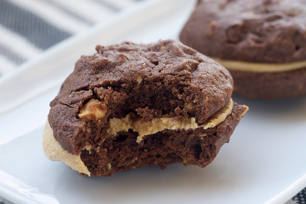 Dark chocolate cookies are sandwiched around a sweet peanut butter filling in these quick and simple Chocolate-Peanut Butter Sandwich Cookies.