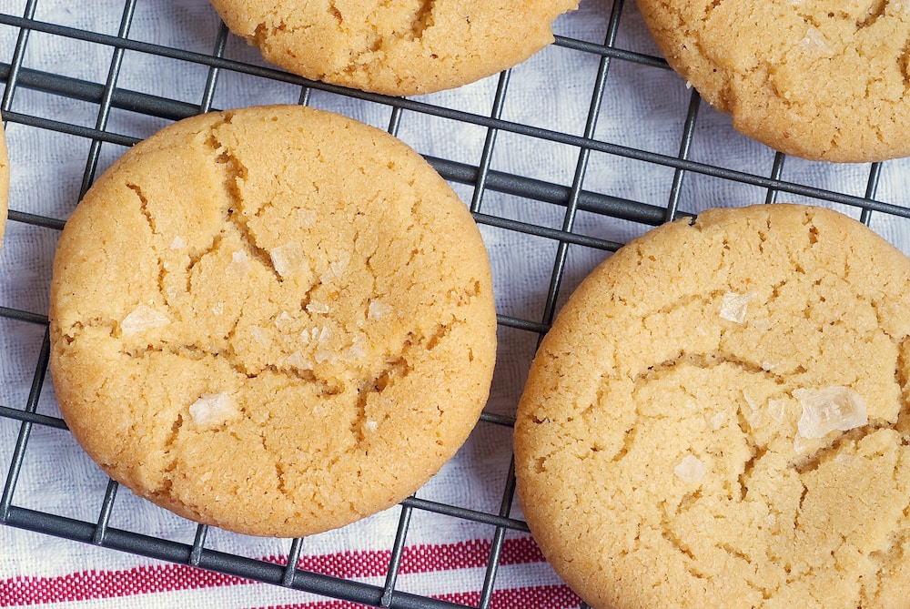 Overhead view of salted brown butter sugar cookies on wire rack