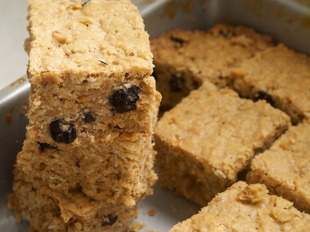 Blueberry-Hazelnut Oatmeal Cookie Bars are packed with oats, cinnamon, brown sugar, nuts, and dried fruit. A great sweet treat or snack! - Bake or Break