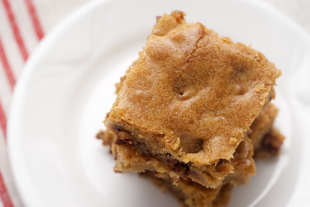 overhead view of Halloween Candy Bar Blondies on a white plate