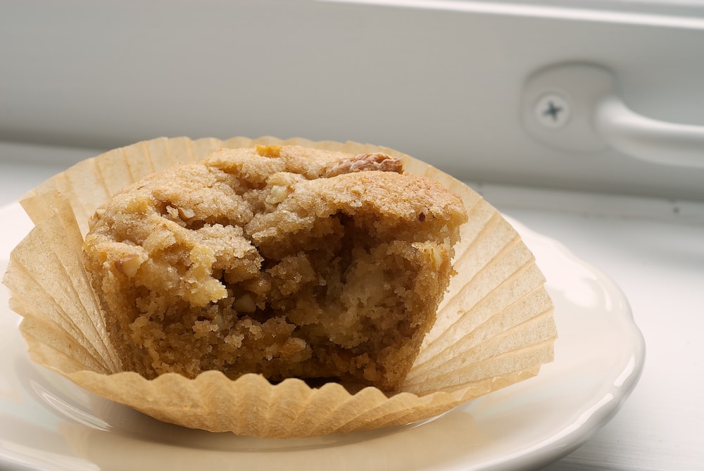 a Pear and Pecan Muffin on a white plate