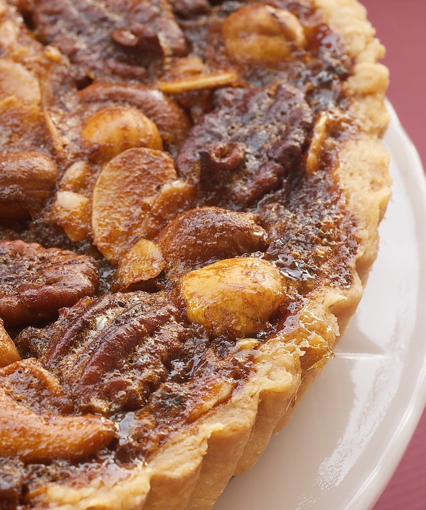 Change up your pecan pie game with this wonderfully delicious Mixed Nut Tart. - Bake or Break 