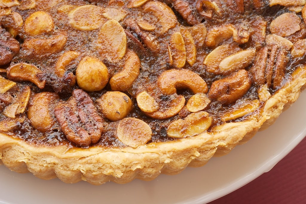 Mixed Nut Tart is perfectly sweet, gooey, and nutty! - Bake or Break