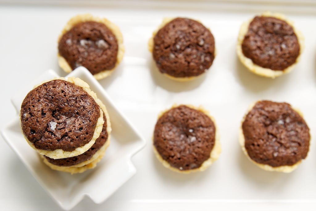 Salty brownie tassies with cream cheese pie crusts.