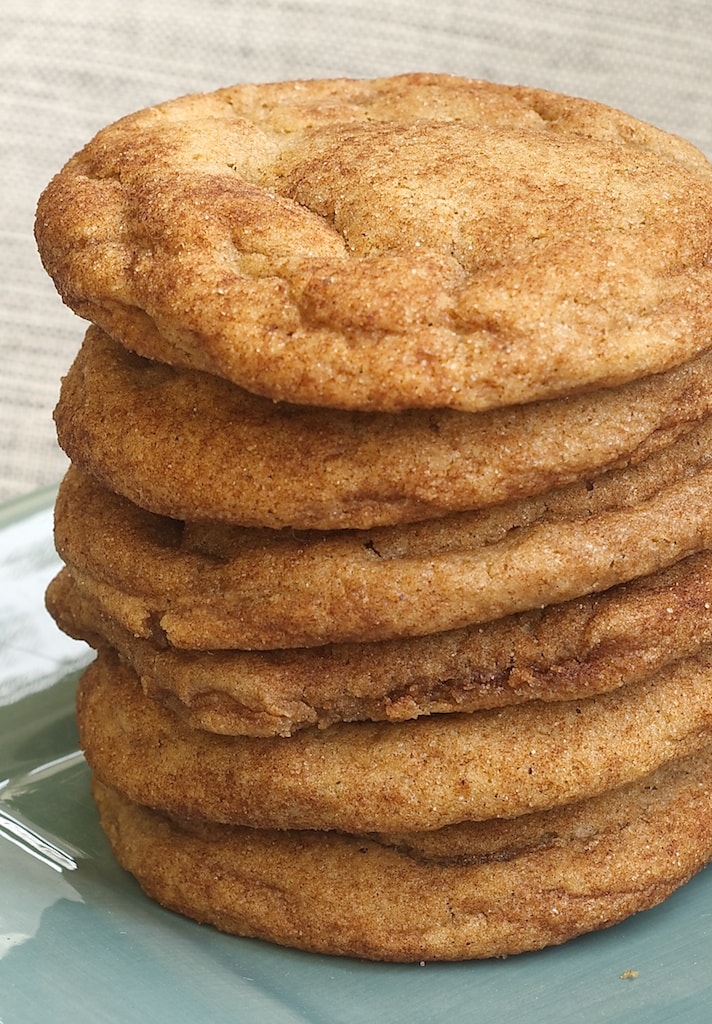 Brown Butter Snickerdoodles stacked on a green plate