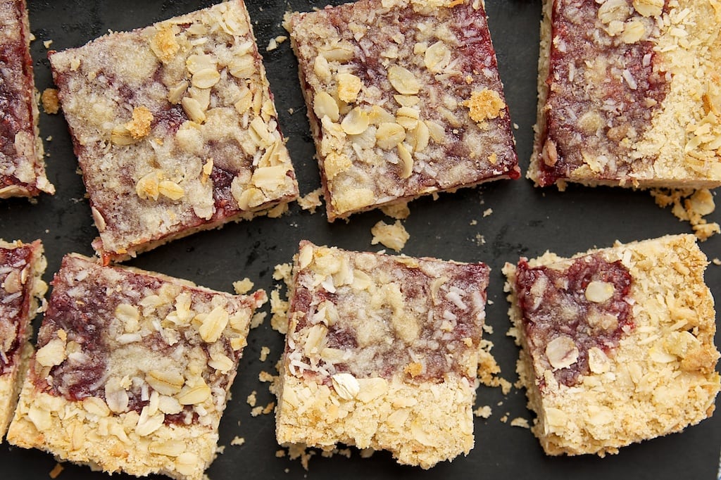 sliced Raspberry Coconut Oat Bars on a cutting board