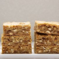 two stacks of brown butter blondies on a white plate