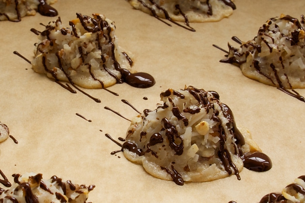 Coconut pecan macaroons drizzled with chocolate.
