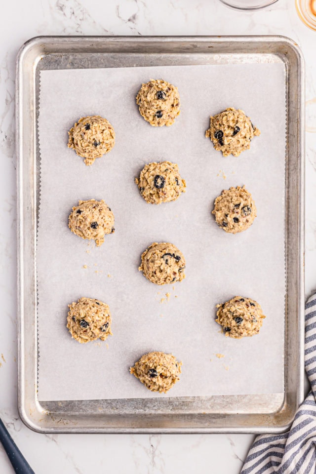 Overhead view of blueberry oatmeal cookie dough on baking sheet