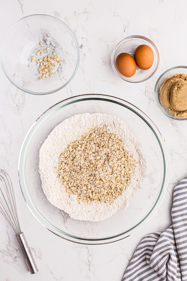 Oats added to dry ingredients in mixing bowl