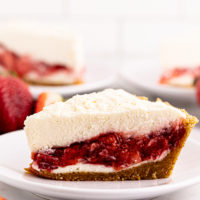 Side view of strawberry icebox pie slice on plate to show layers