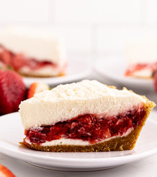 Side view of strawberry icebox pie slice on plate to show layers