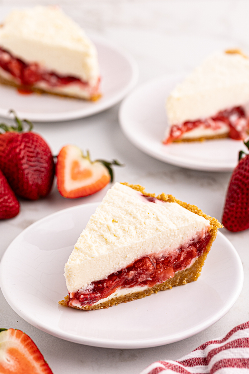 Fluffy slice of strawberry icebox pie on plate