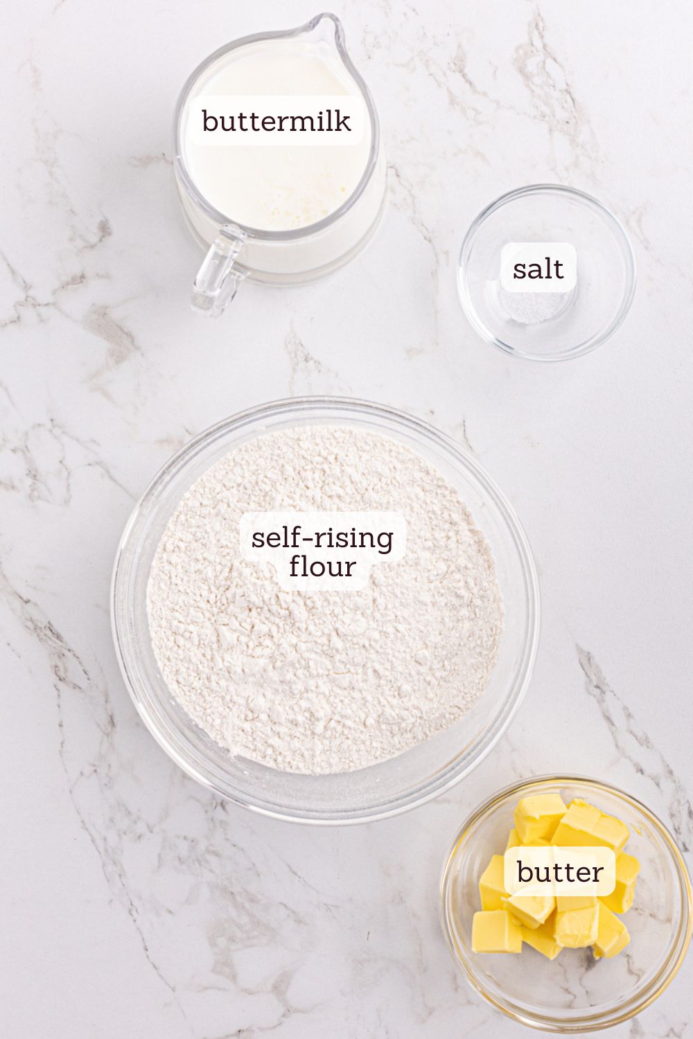 Overhead view of ingredients for buttermilk biscuits with labels