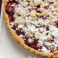 A sweet almond crust, fresh raspberries, and a crumb topping make this Raspberry Almond Crumb Tart a perfect summer dessert! - Bake or Break