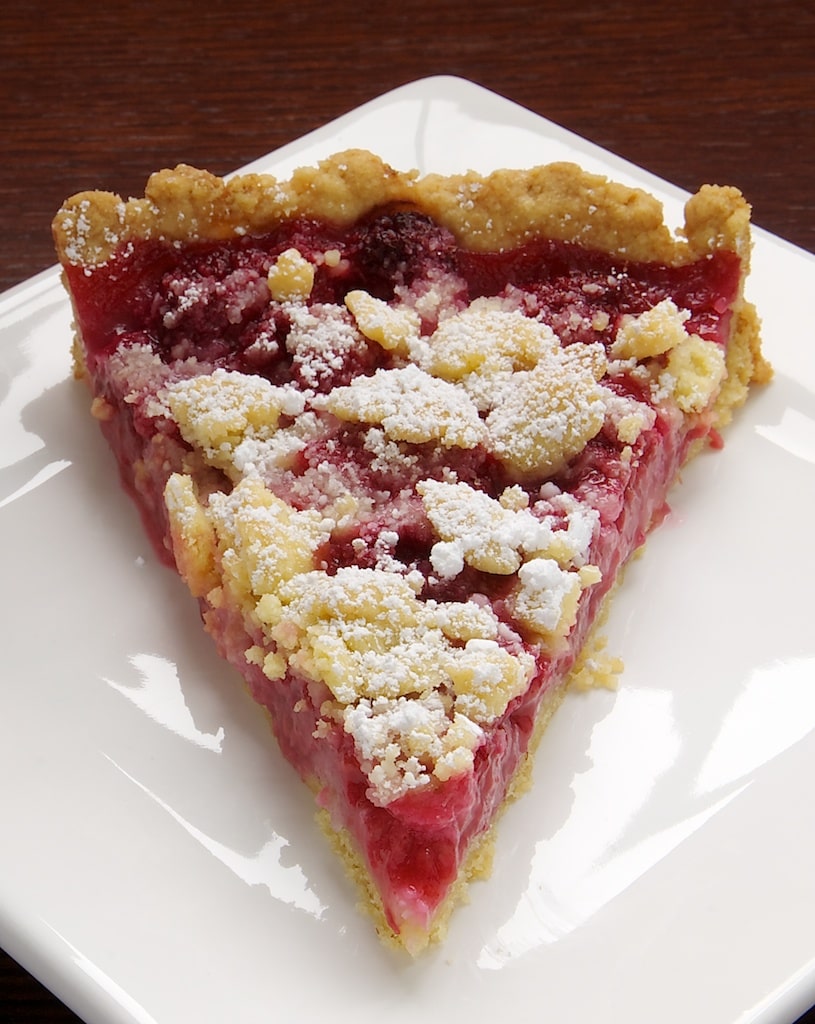 A sweet almond crust, fresh raspberries, and a crumb topping make this Raspberry Almond Crumb Tart a perfect summer dessert! - Bake or Break