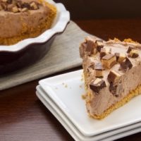 A slice of Peanut Butter Cup Icebox Pie on a plate