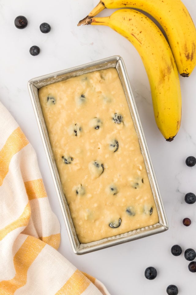 Banana bread batter in a loaf pan.