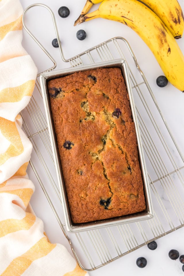 Baked blueberry banana bread in a loaf pan.
