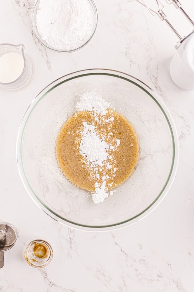 Powdered sugar added to liquid ingredients for frosting