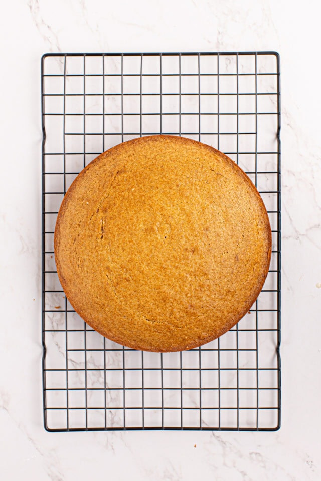 Vanilla cake cooling on wire rack