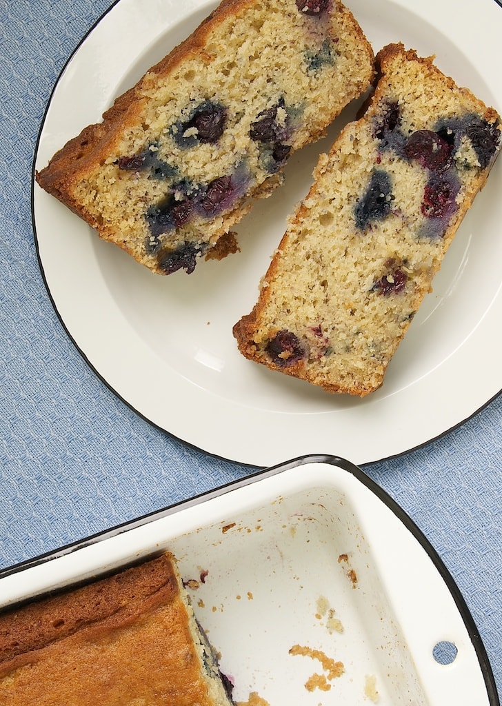 Two slices of Blueberry Banana Bread on plate
