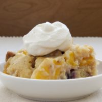 Blackberry Peach Cobbler served in a shallow white bowl