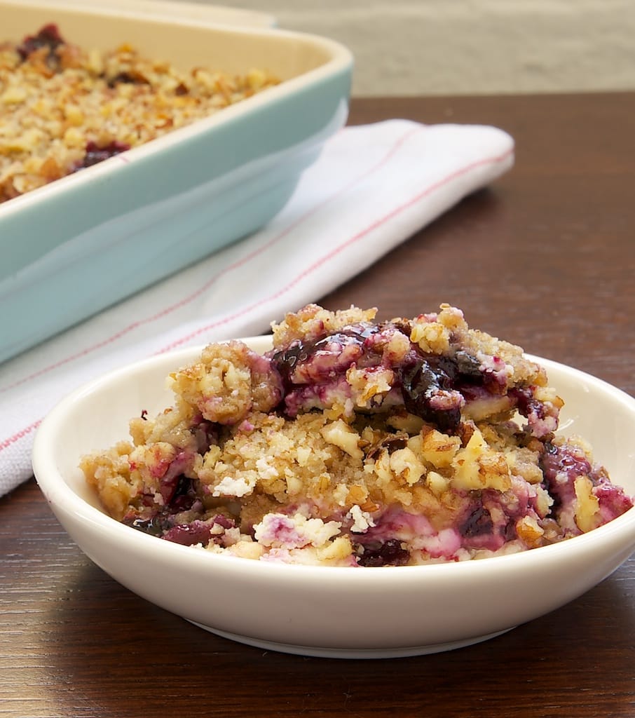 Blueberry Cream Cheese Crisp served in a shallow white bowl