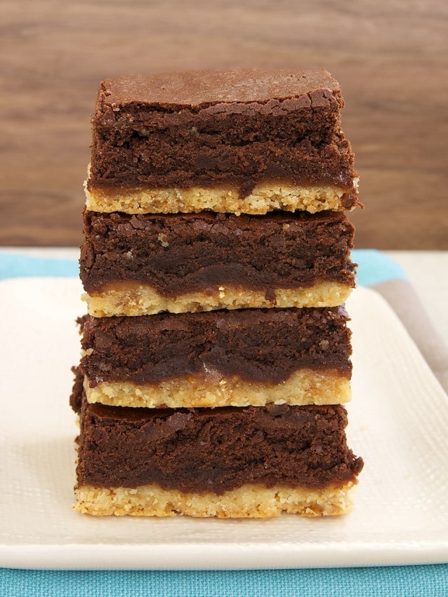 stack of Caramel Popcorn Shortbread Brownies on a white plate